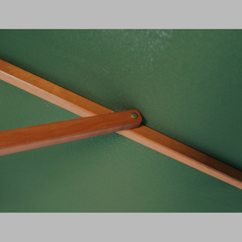 Showing the strong rib connection on a green 2.5m wood pulley parasol