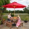Red 250cm wood pulley parasol in picnic table setting
