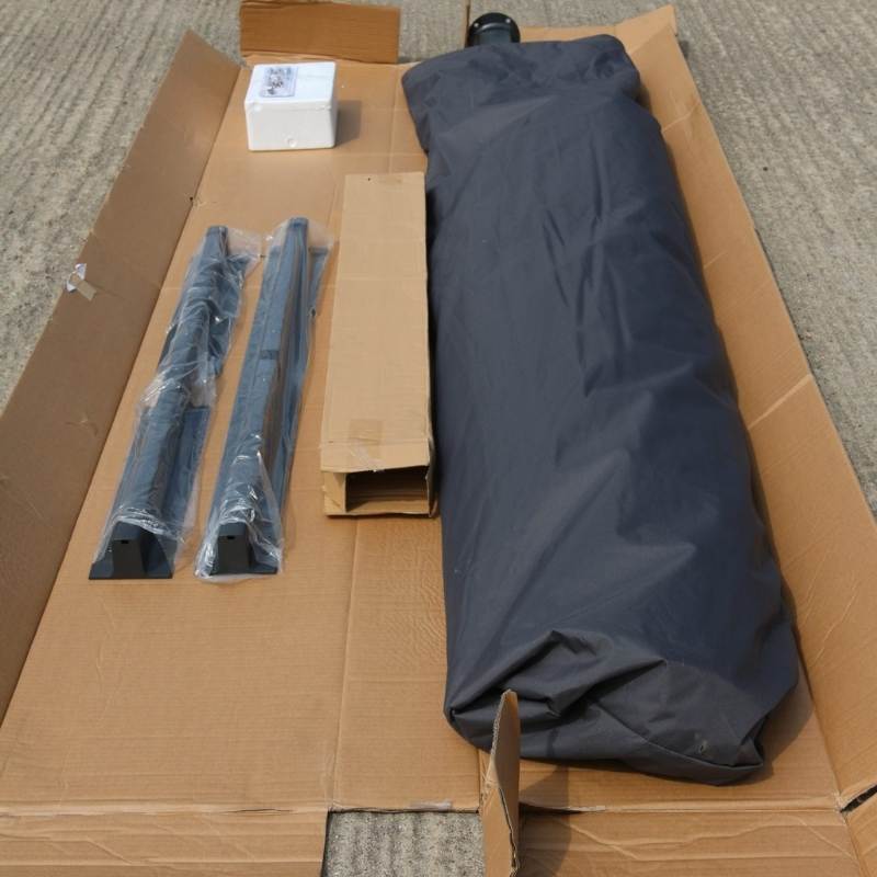 Image of parasol cross base being unpacked