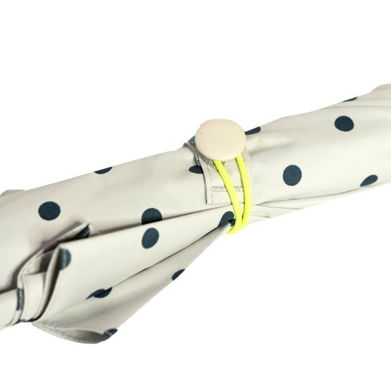 close-up showing tie wrap closure of Ezpeleta Ladies UV Protective Walking Umbrella with spotted canopy design