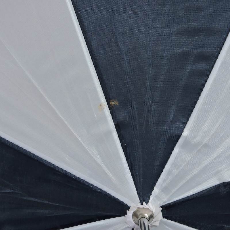 Blue and white mini golf umbrella canopy close-up